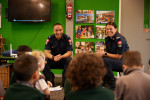 Two fire fighters in front of a class